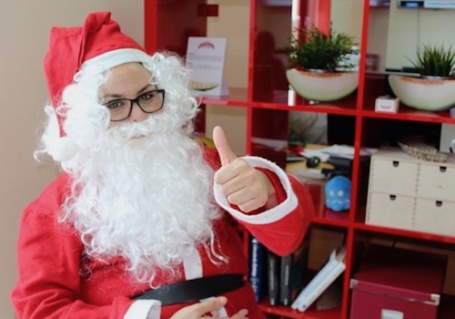 Santa sitting on a Chair Giving the Thumbs-up 