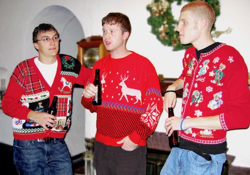 Three Guys in Ugly Red Christmas Sweaters Standing around Drinking Beer