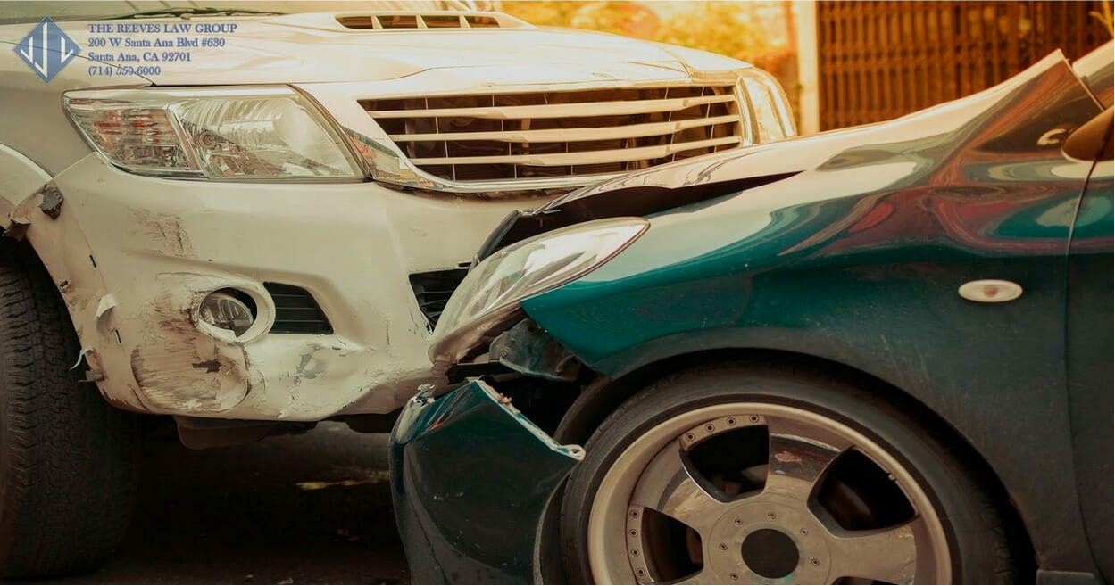 types of car accidents green and white car damaged bumper and headlights