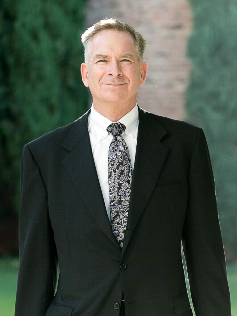 Derek Pakiz Portrait in Suit with Green background 